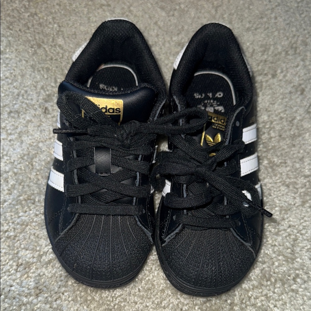 Adidas Kids Black and White Sneakers with Gold Accents